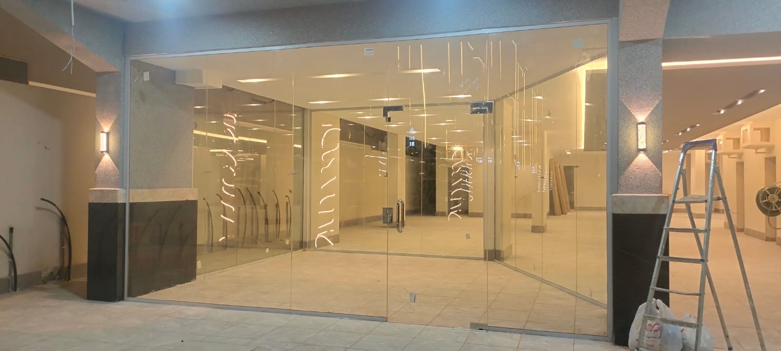 Frameless glass storefront with double entry doors