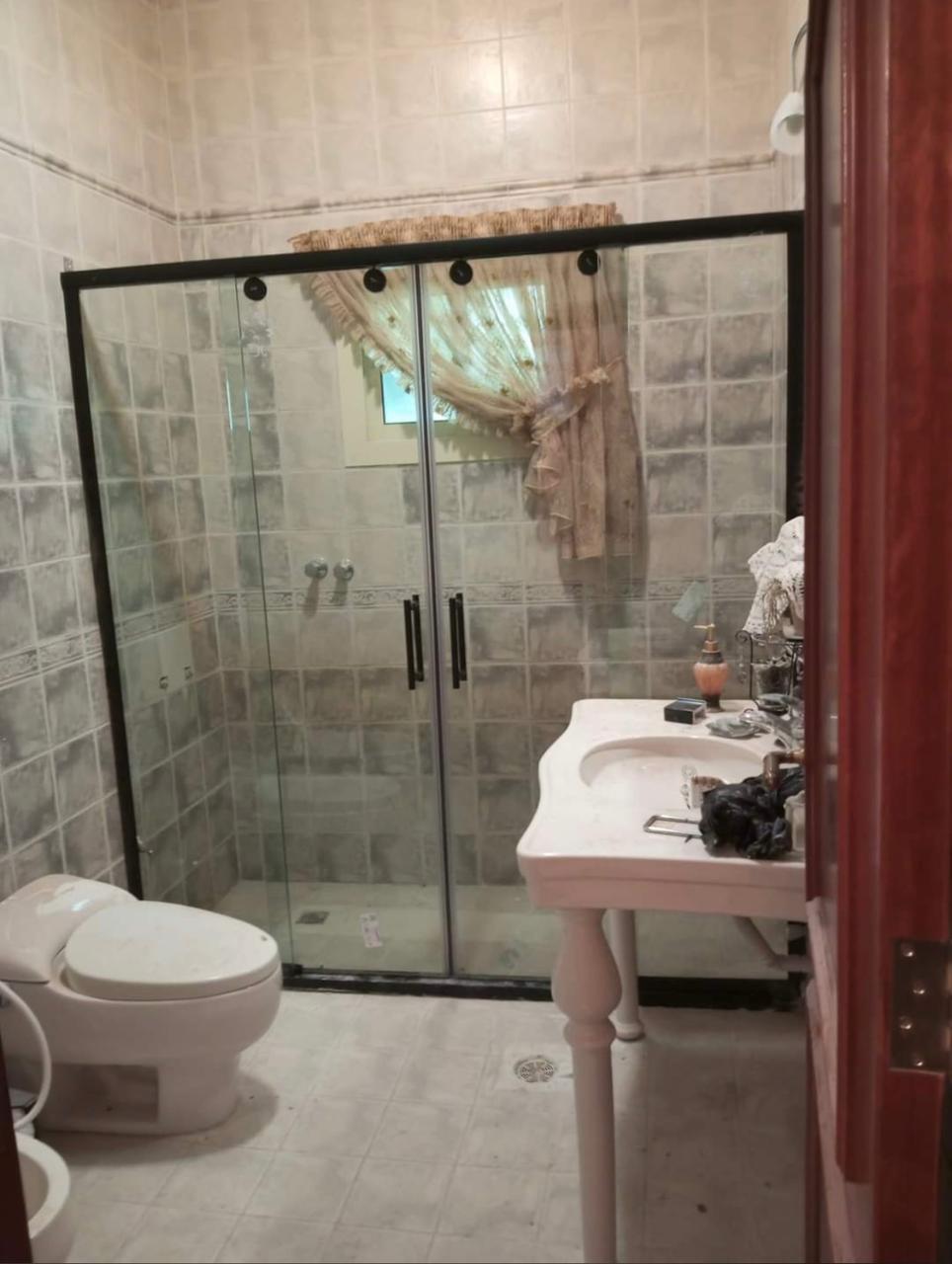Black-framed walk-in shower screen